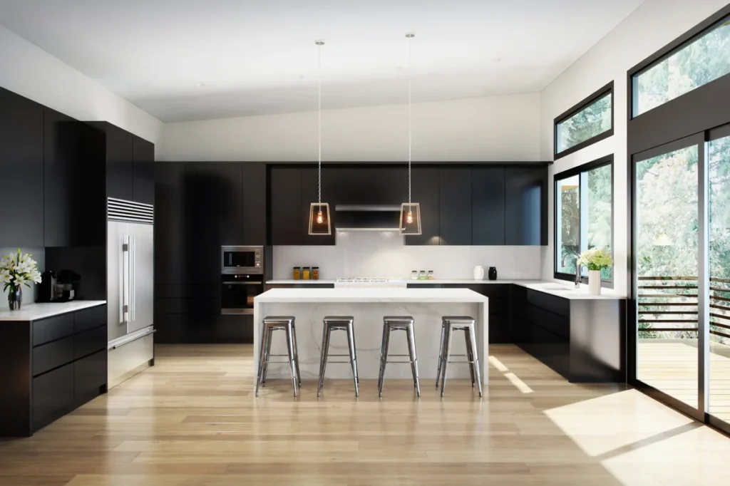 Modern kitchen renovation with matte-black cabinetry, a white quartz island, and forest views in a Seattle-area home by Piper Cole Architects.