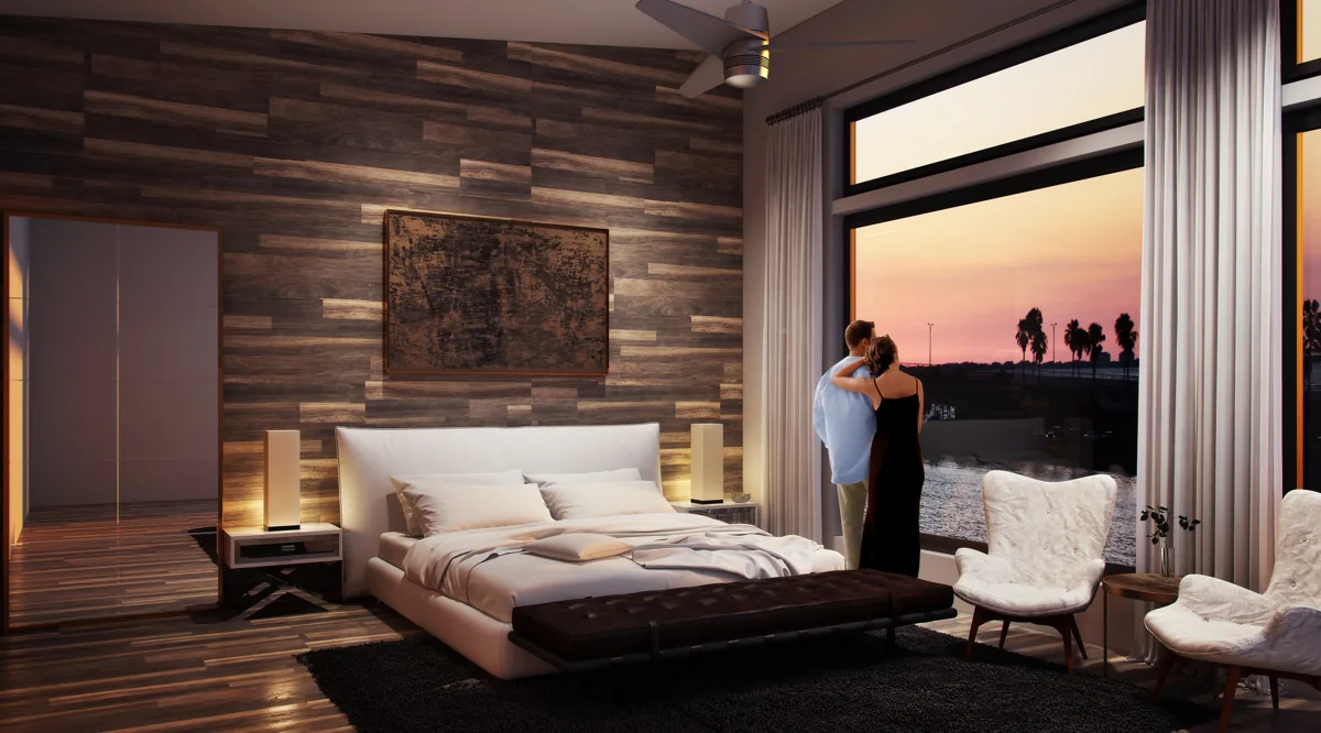 Warm-wood master bedroom addition with floor-to-ceiling windows framing a sunset view, designed by Piper Cole Architects on the Seattle Eastside.