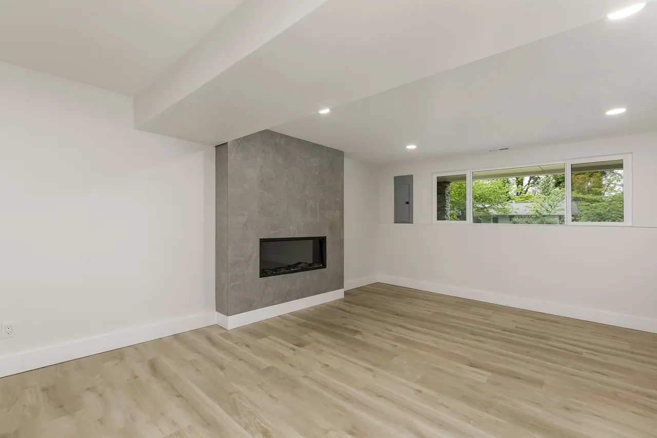 Bellevue Remodel: lower-level room with fireplace
