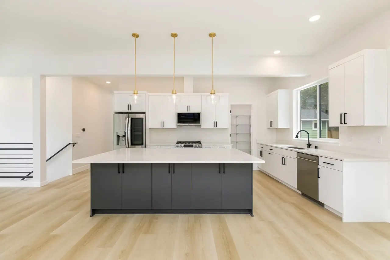 Bellevue Remodel: kitchen with dark island and pendants