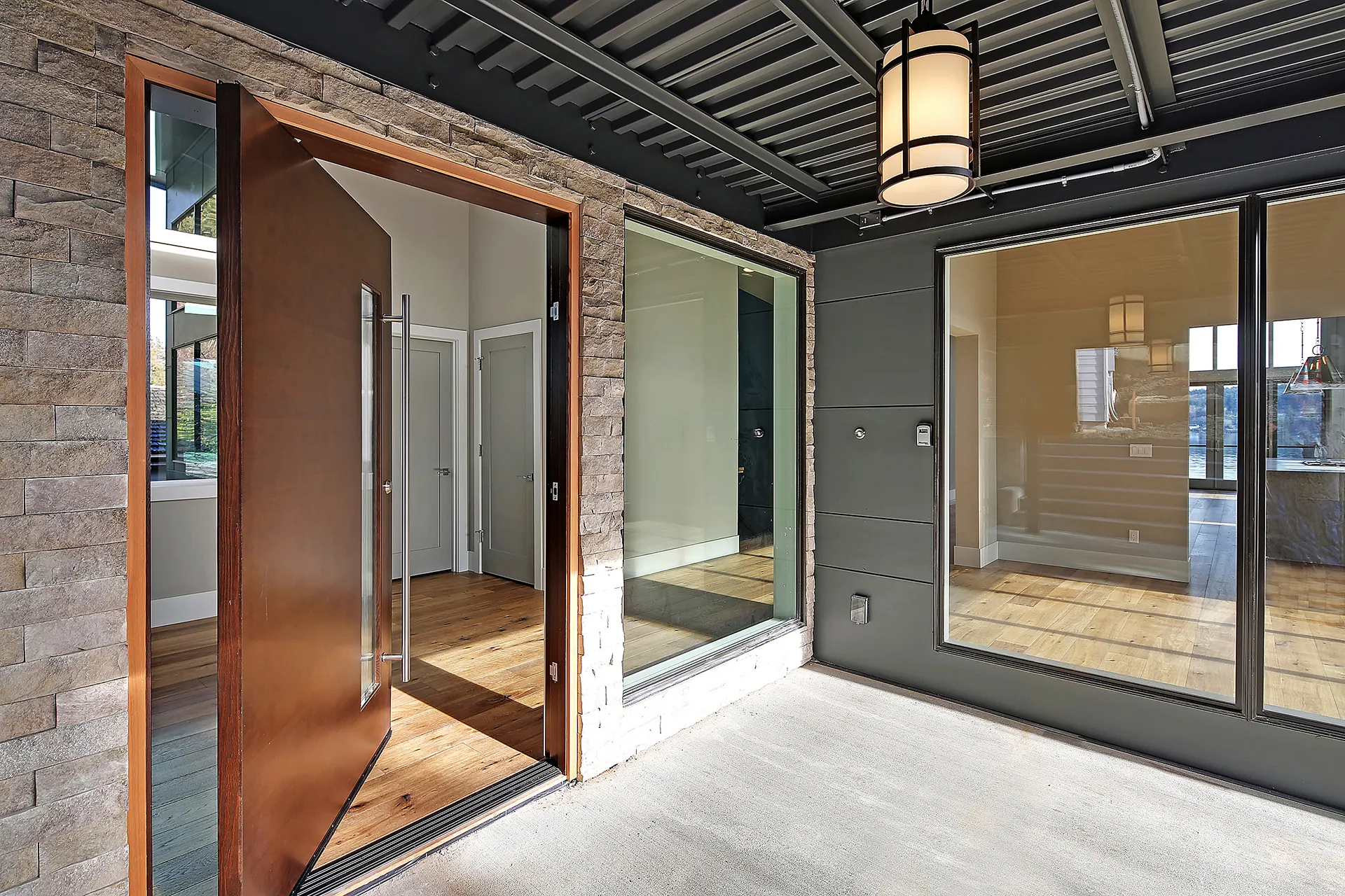 Huang Residence: covered entry and pivot door
