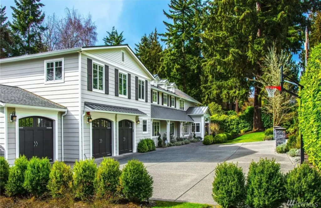 Medeiros Residence: front elevation with three-car garage